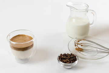 Cold dalgona coffee. Whipped instant coffee. Popular coffee. Latte espresso with coffee foam in a glass.