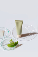 Glass petri dish with transparent pure serum for skin care