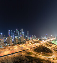 Fototapeta na wymiar Cityscape and skyline at night in Dubai Marina.