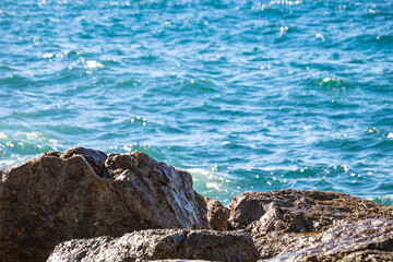 waves splashing at rocky shore of Mediterranean Sea, Prado beach, Marseille, France