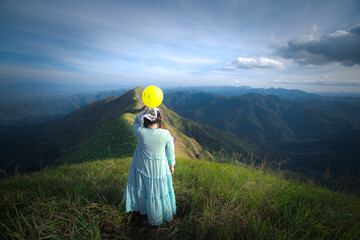 happy hiking woman on top of mountain at Khao Chang Puak, Thongphaphum National Park, Kanchanaburi...