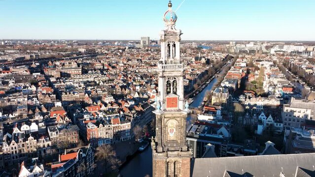 Amsterdam city center aerial drone view of the Westerkerk and the Jordaan urban area in the city center of Amsterdam. Along the canals.