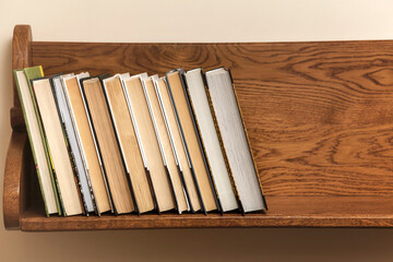 Books on wooden Shelf. Reading book concept. World Book Day. Copy space.