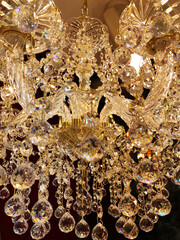 Beautiful twinkle crystal chandelier close up, warm light