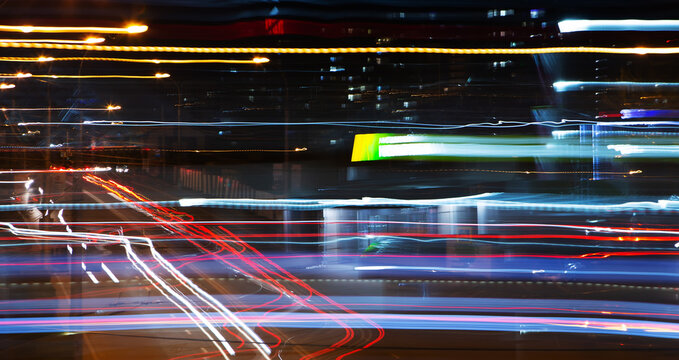 Abstract urban background with light tracks. New technology concept. © Iuliia