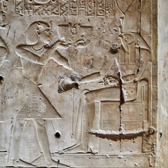 A wall relief from Abydos temple of Seti I, Depicting the king presenting offerings to god Horus