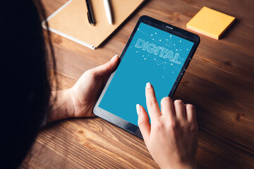 woman working in tablet with digital text