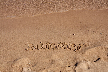 Inscription Summer on the sand on the shores of the Red Sea.