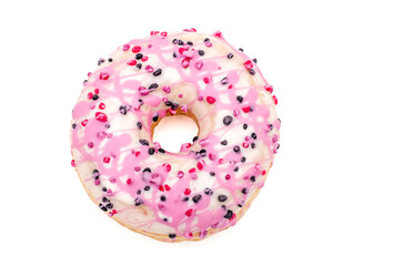 donut with white and pink chocolate icing and berries on white background, top view