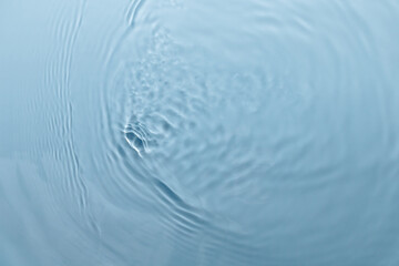 Blue water texture, blue pure water surface with waves and ripples. Flat lay, copy space