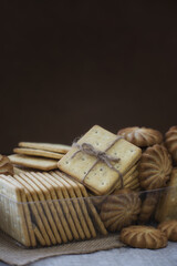 A stack of crackers tied with string on sackcloth. 