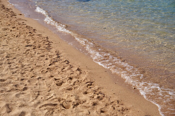 Waves on the tropical sandy beach of the red sea.