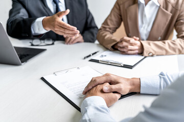 Job interview, Two selection committee manager asking questions to applicant about work history,...