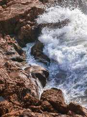 Waves crashing on the coastal rocks