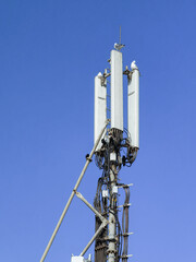 4G+ transmitters tower with blue sky in the background