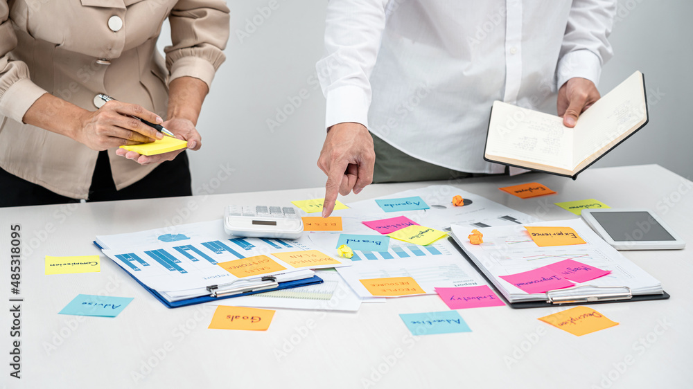 Poster business people team, boss holding book and pointing data on the table to explaining about new busin