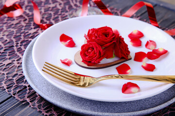 Valentine's Day Serving. Beautiful table setting with scarlet roses