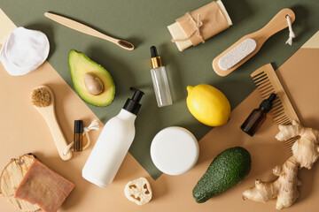 eco-friendly body care products, massage brushes and mock-up bottles with cosmetics based on...