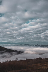 Naklejka na ściany i meble Beautiful landscape from the top of the mountain. Cloudy sky - above the clouds. Carpathians