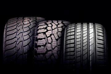 new mud tire for off-road cars SUV close-up tread on black background - obrazy, fototapety, plakaty