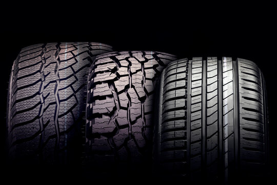 new mud tire for off-road cars SUV close-up tread on black background