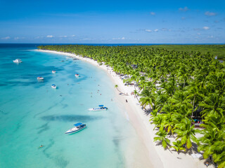 Aerial view of Saona Island in Dominican Republuc. Caribbean Sea with clear blue water and green...