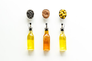 Different kind of cooking oil - sunflower olive and sesame oil with seeds