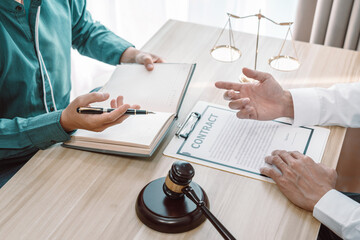 Male lawyer counselor are meeting with client to discuss consultation with litigation contract...