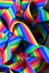 Colorful pinwheels decorating the tables of a birthday celebration