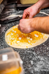 hand of chef baker making pizza at kitchen. The process of making pizza. cooking italian pizza