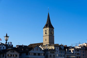 Fototapeta na wymiar Church tower of medieval protestant church St. Peter at the old town of Zürich on a sunny winter day. Photo taken February 5th, 2022, Zurich, Switzerland.