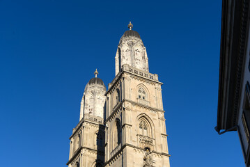 Fototapeta na wymiar Twin towers of medieval protestant church Great Minster at the old town of Zürich on a sunny winter day. Photo taken February 5th, 2022, Zurich, Switzerland.