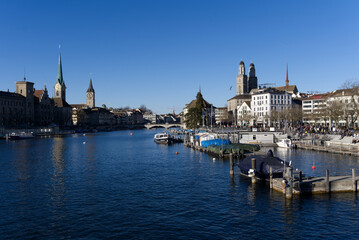 Fototapeta na wymiar Skyline of the old town of Zürich on a sunny winter afternoon with river Limmat in the foreground. Photo taken February 5th, 2022, Zurich, Switzerland.