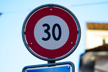 Close-up of speed limit 30 traffic sign at the old town of Zürich on a sunny winter day. Photo...