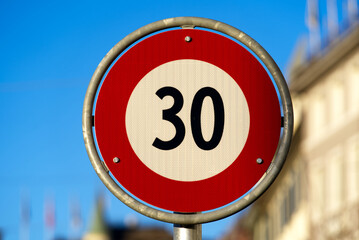 Close-up of speed limit 30 traffic sign at the old town of Zürich on a sunny winter day. Photo...