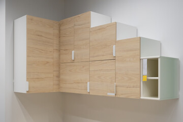 Corner wall cabinet. The cabinet is made in beige shades