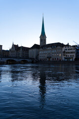 Church tower of medieval protestant church Women's Minster at the old town of Zürich on a sunny winter day. Photo taken February 5th, 2022, Zurich, Switzerland.