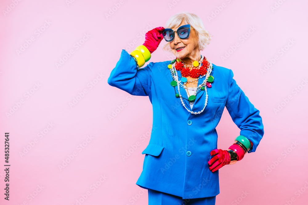 Wall mural Cool and stylish senior old woman with fashionable clothes