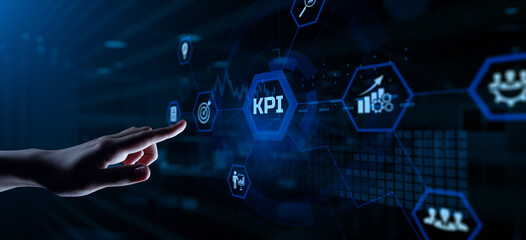 KPI Key Performance Indicator. Hand pressing button on screen.