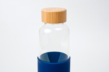 Stylish glass water bottle with wooden lid. For fitness and travel.