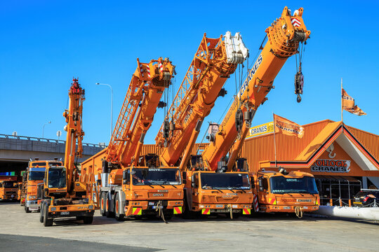 A row of truck-mounted cranes manufactured by Grove, one of the world's leading producers of mobile hydraulic cranes. Tauranga, New Zealand, January 2 2019