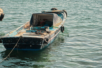Single fisherman boat, small wooden made of boat sailing in bosporus water in istanbul.