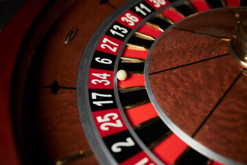 Casino theme. image of casino roulette, poker game. roulette wheel. online casino, bets, winnings. Luxury roulette in the casino. roulette wheel and ball in winning number thirty four. close-up image
