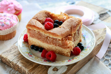 Apple pie decorated with raspberries and blueberries