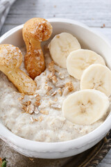 Porridge with bananas in a bowl.