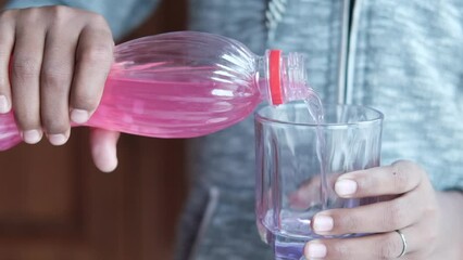  slow motion of pouring soft drinks in a glass 