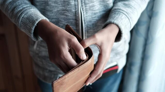 slow motion of man hand open an empty wallet with copy space.