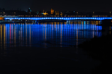 The Gdańsk Bridge over the Vistula River in Warsaw at night
