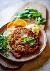 Pork breaded cutlet coated with breadcrumbs with mashed potatoes