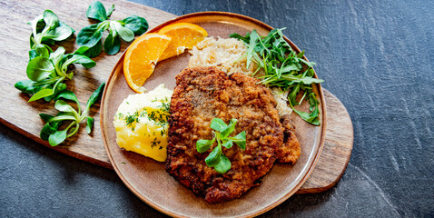 Pork breaded cutlet coated with breadcrumbs with mashed potatoes